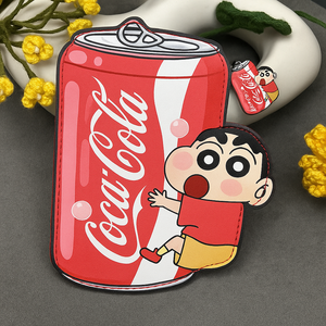 Coca-Cola can-shaped product with a cartoon character on a gray background